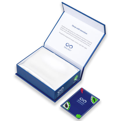 SILKAVA silk pillowcase in packaging alongside Origin Series collectible card, white